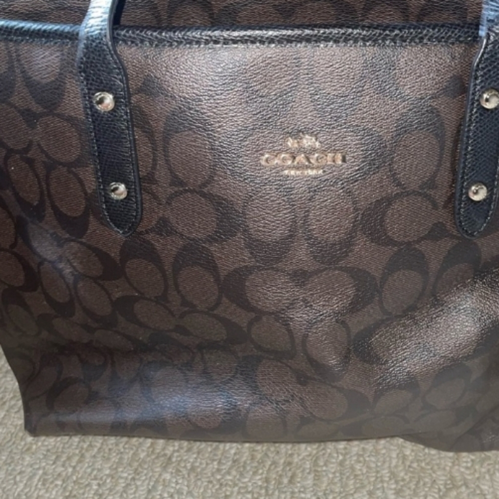 Black and brown leather coach tote.